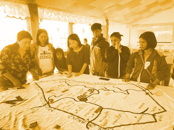 Green Releaf: Ecosystem mapping of organic farming and ecotourism; people standing by table